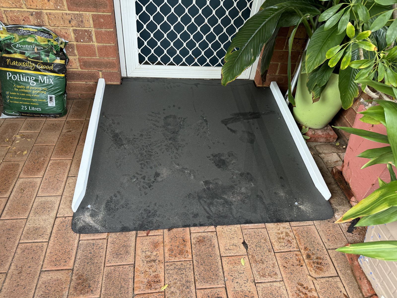 Low-gradient front-entry ramp installed at a home
